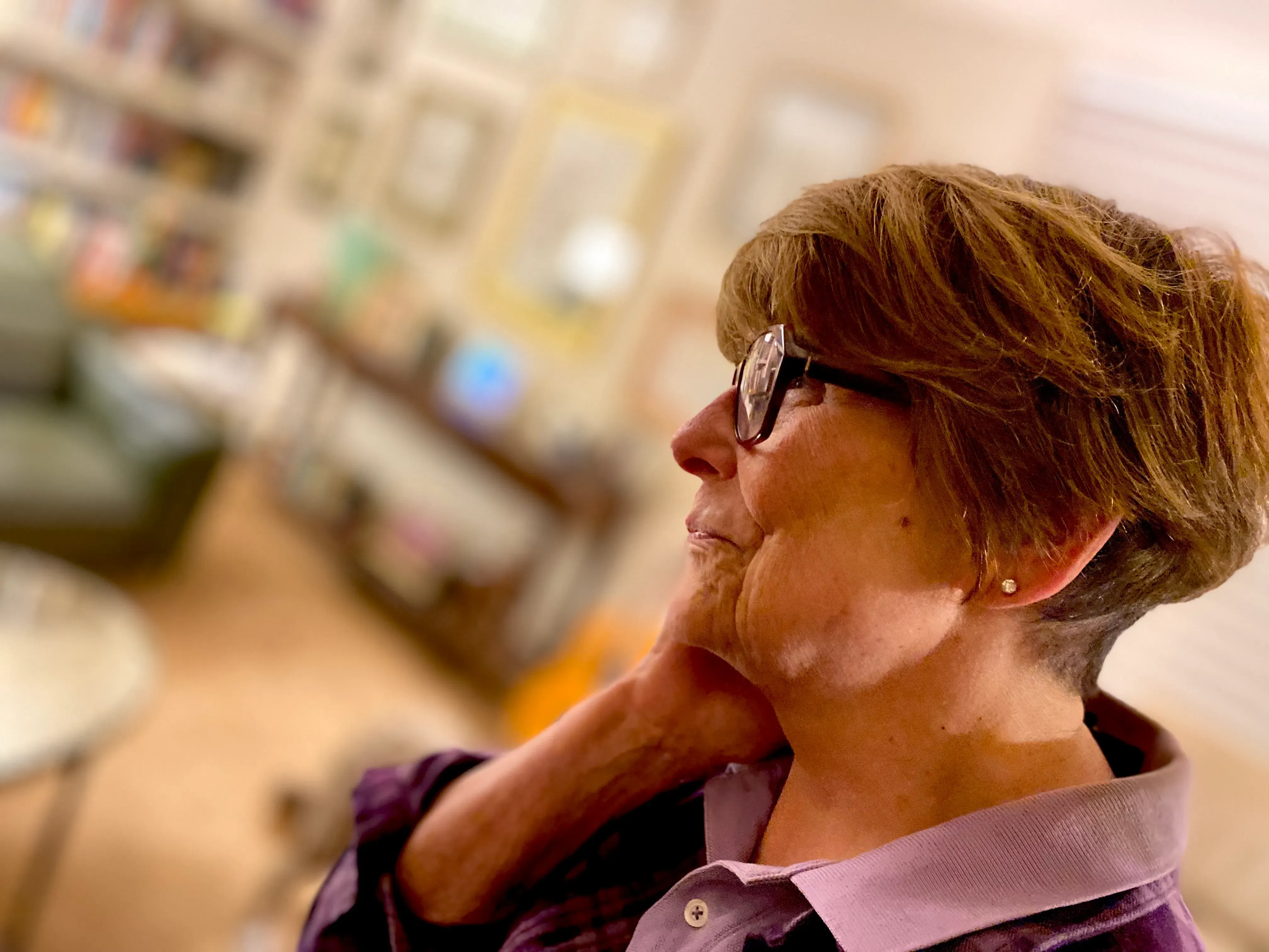 Susan in profile, resting her chin on her hand